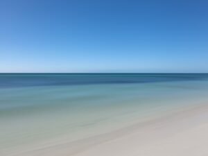 Witness the Atlantic Ocean at its calmest during midday at Bahia Honda State Park, captured to perfection in this elegant and minimalistic artwork.