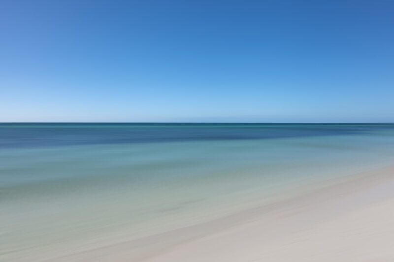 Witness the Atlantic Ocean at its calmest during midday at Bahia Honda State Park, captured to perfection in this elegant and minimalistic artwork.