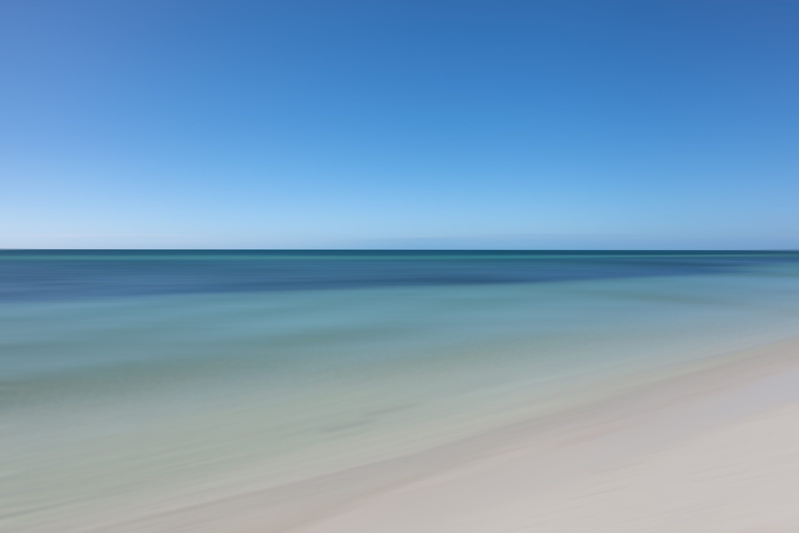Witness the Atlantic Ocean at its calmest during midday at Bahia Honda State Park, captured to perfection in this elegant and minimalistic artwork.