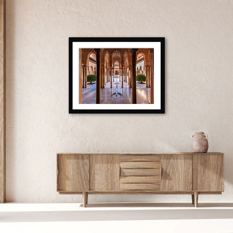 A captivating glimpse into the heart of Alhambra’s Nasrid Palace, embodying tranquility and architectural brilliance.