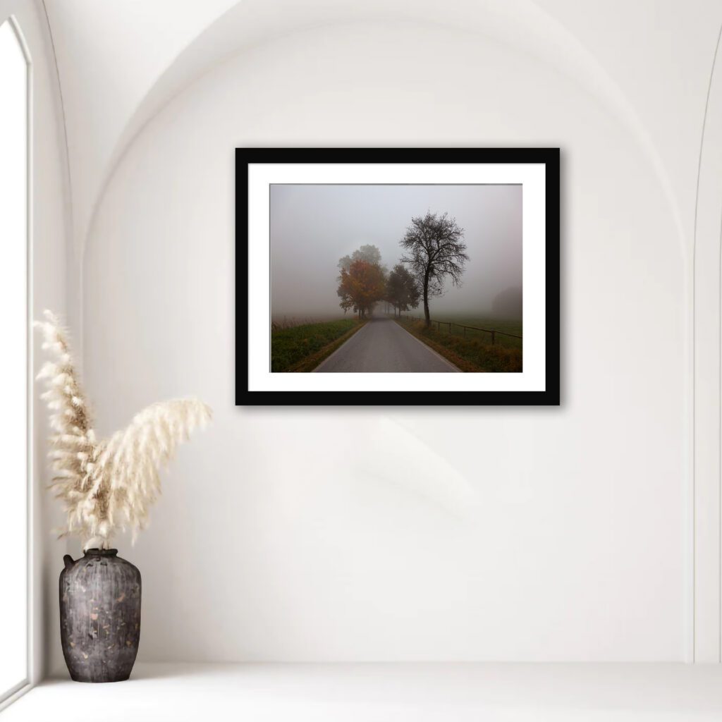 Explore the tranquil beauty of Czech landscapes with this evocative print depicting a lonely, fog-enveloped road during autumn