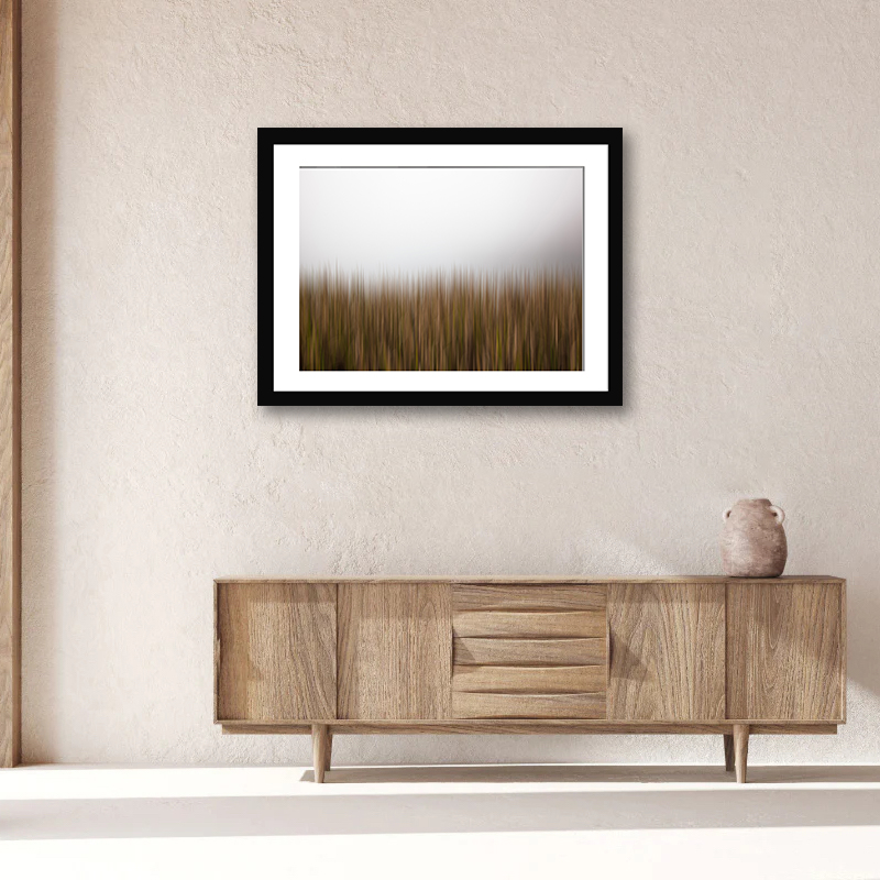 Immerse in the sublime beauty of yellow reeds set against a misty backdrop. A piece that adds a gentle touch of wilderness to your space.