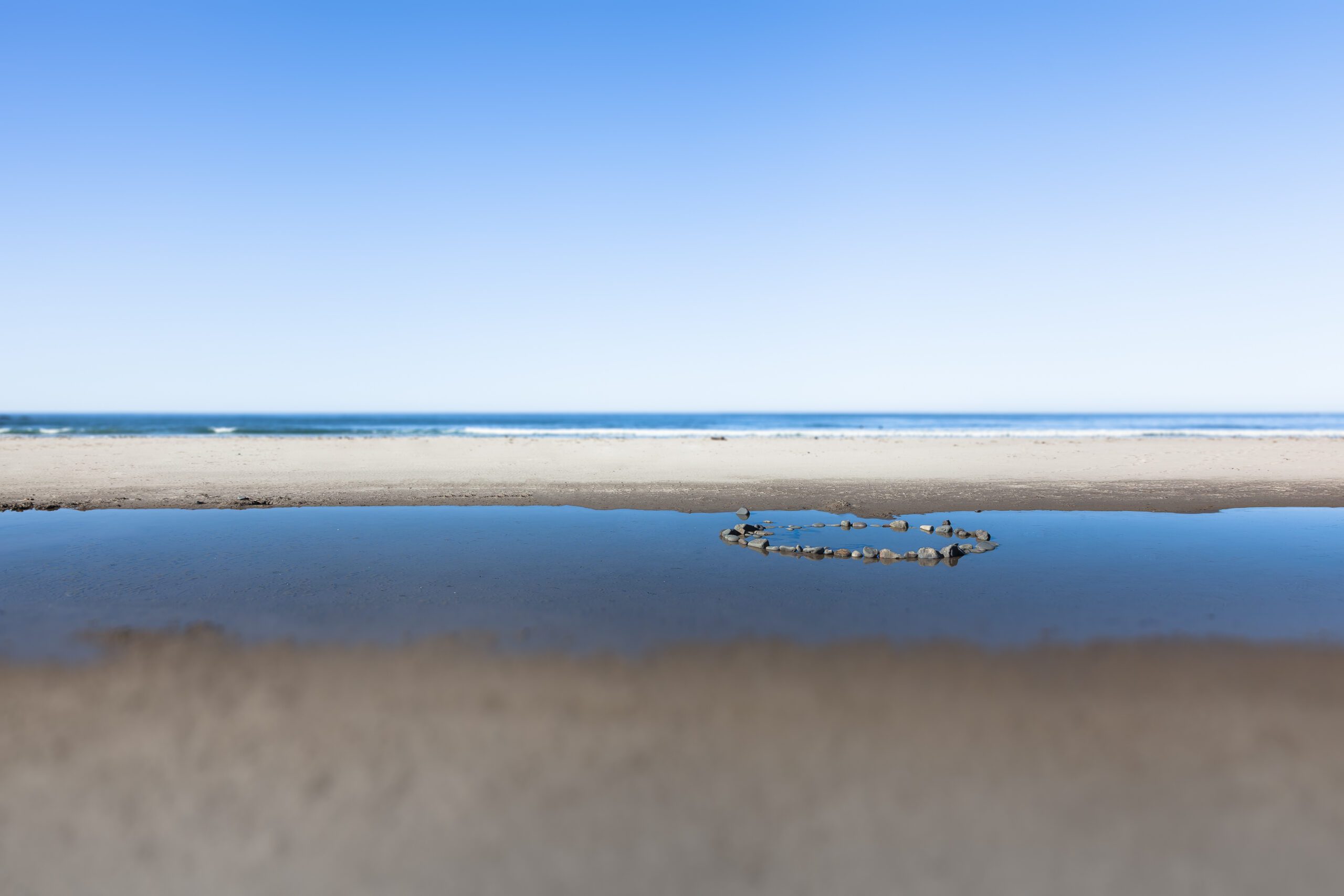 Discover the magical intersection of stone and sea with this evocative image, capturing a moment of tranquillity on the Oregon Coast.