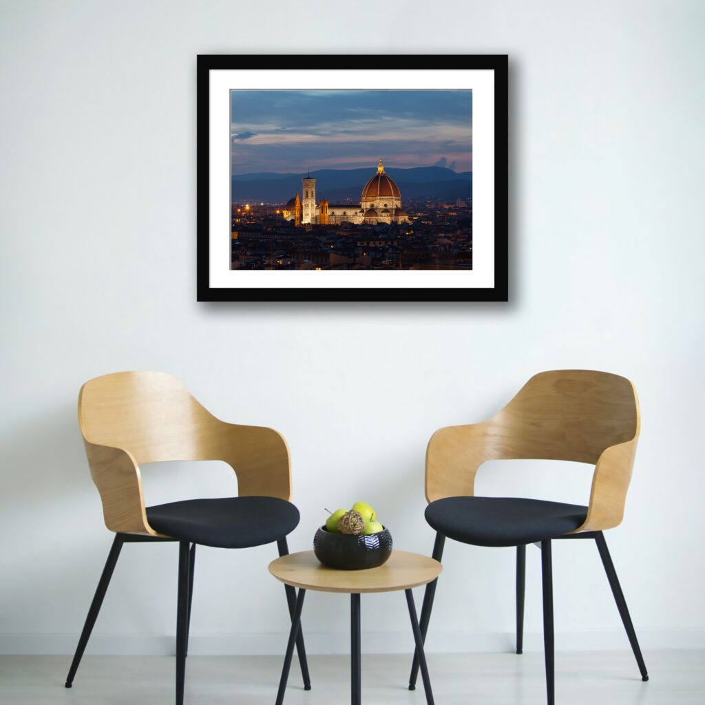 Evening view of Florence Duomo with city lights.