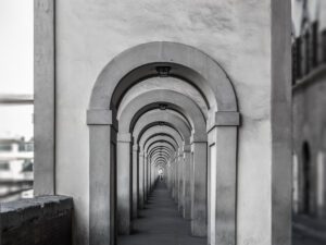 Monochromatic view of arched doorways in Florence.