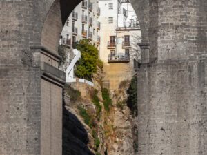 Ronda's iconic stone bridge with historic buildings backdrop