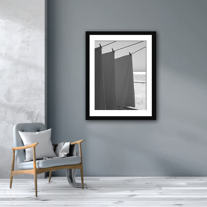 Monochrome photo of hanging linens in Fira, Santorini