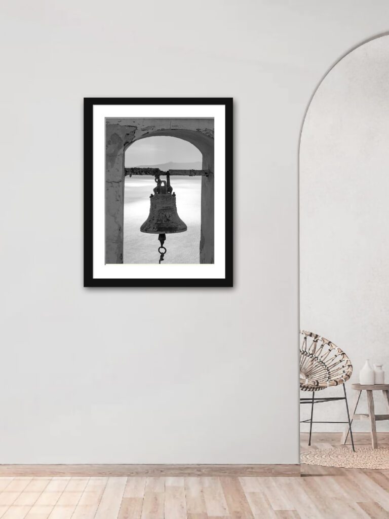 Ancient bell in black and white, overlooking the caldera in Santorini, Greece.